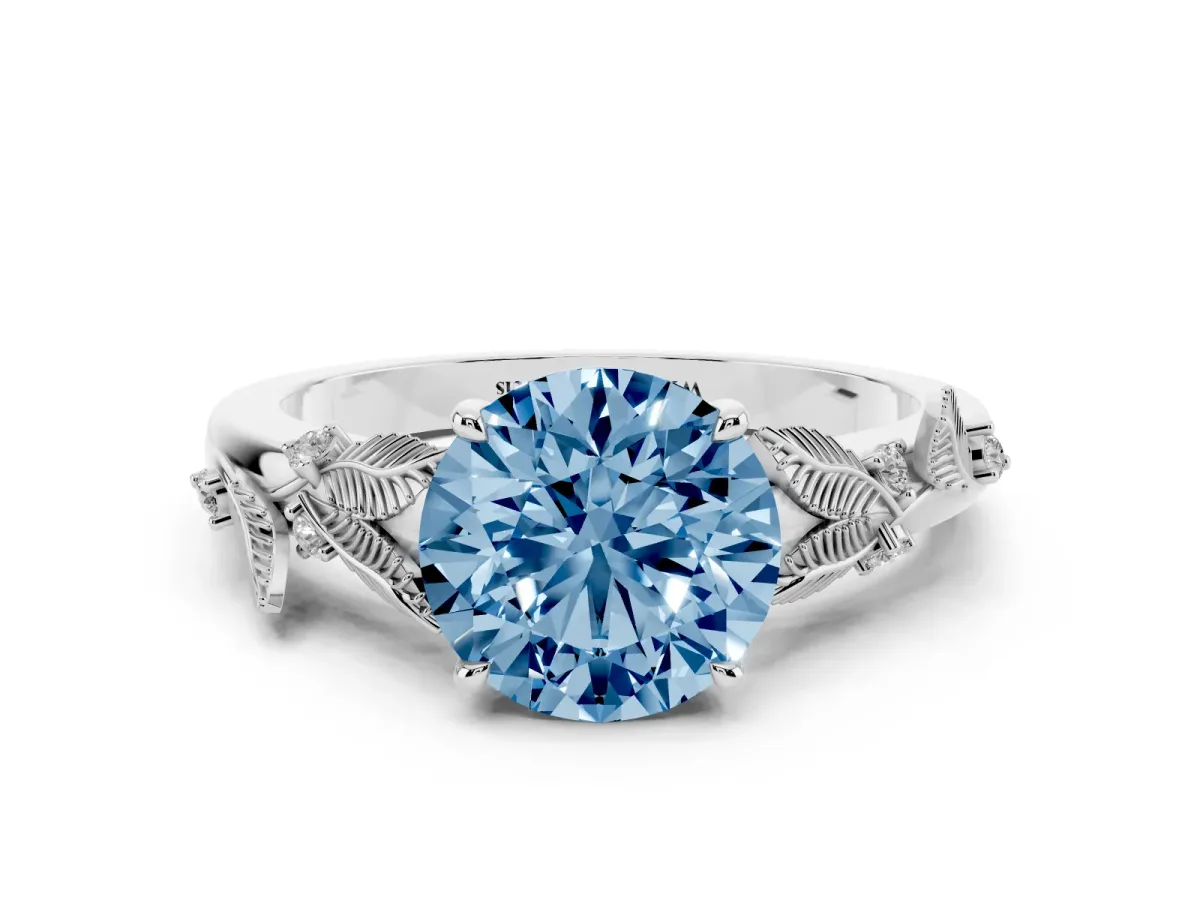 Fancy Blue Round Cut Diamond Solitaire Ring with Leaf Motif Band and Four-Prong Setting Silver
