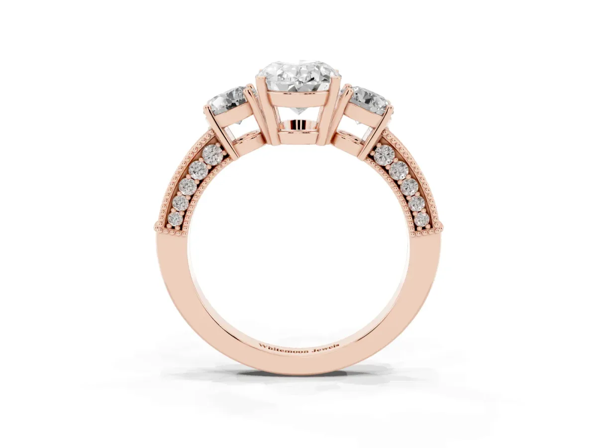 Oval Cut Three-Stone Diamond Ring with Pavé Band and Four-Prong Setting Rose gold