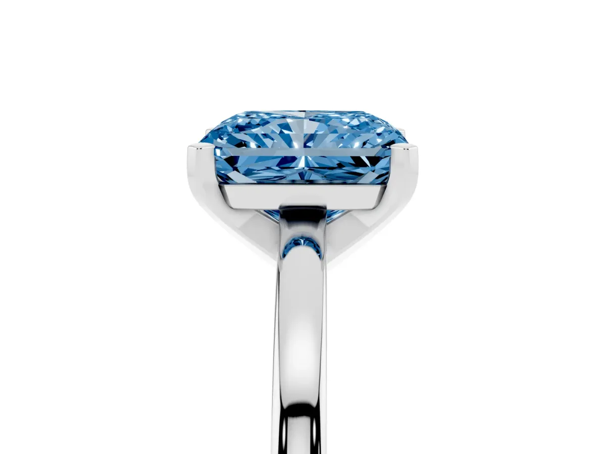 Fancy Blue Radiant Cut Solitaire Diamond Engagement Ring with Four-Prong Setting on a Classic Band Platinum