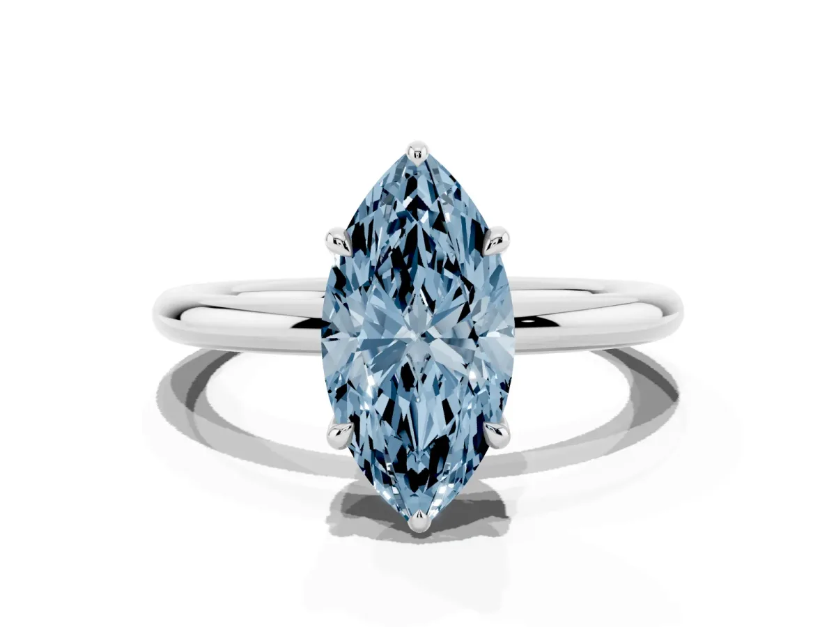 Fancy Blue Marquise Cut Diamond Solitaire Ring with Thin Band and Four-Prong Setting Silver