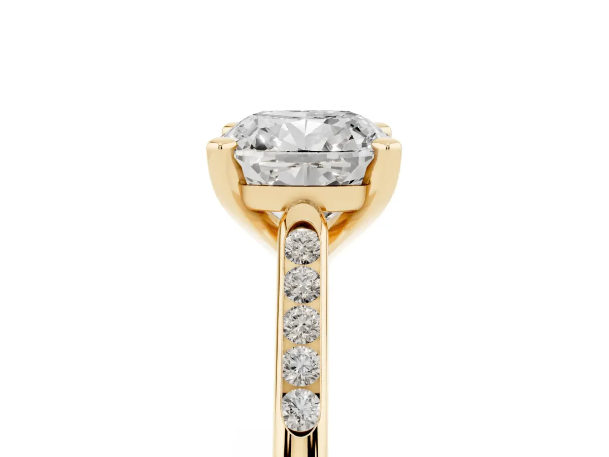 Cushion Cut Diamond Solitaire Ring with Channel Set Round Band and Prong Setting Yellow gold