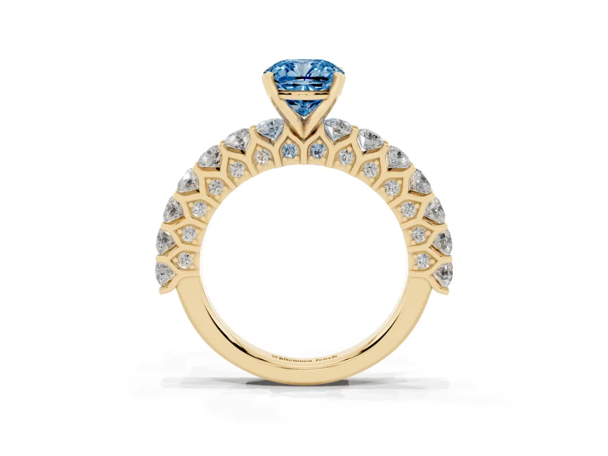 Fancy Blue Cushion Cut Diamond Solitaire Ring with Shared Prong Pavé Band and Four-Prong Setting Yellow gold
