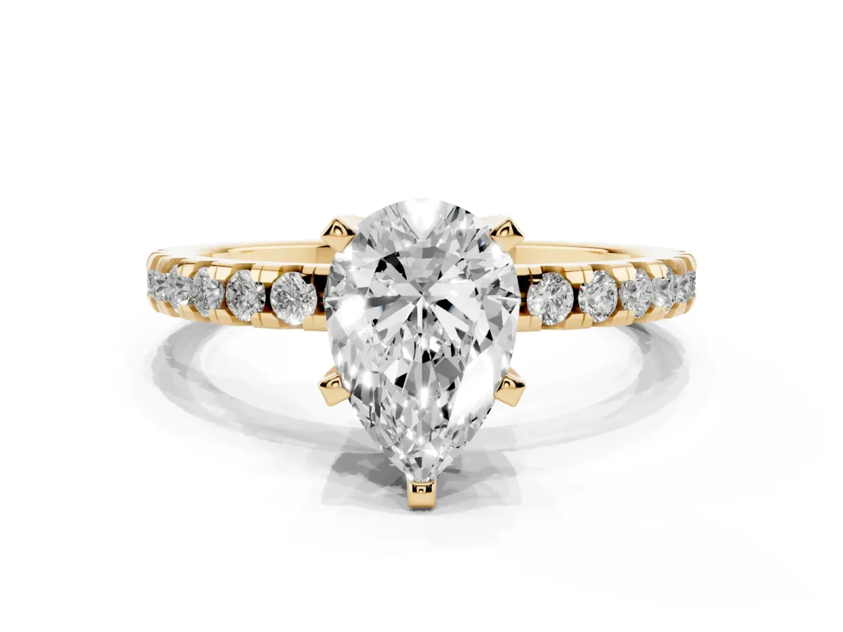 Pear Cut Diamond Solitaire Ring with Round Pavé Band and Four-Prong Setting Yellow gold
