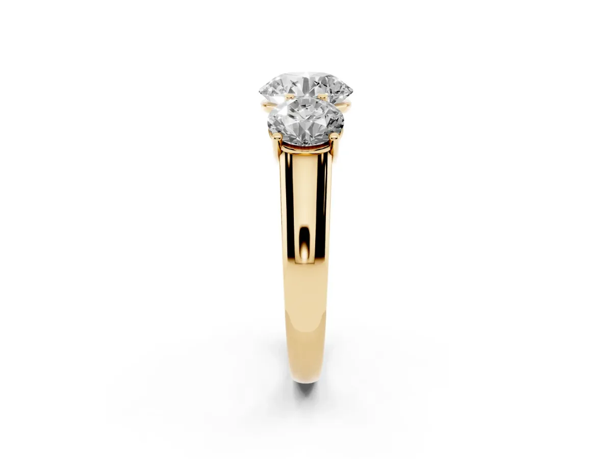 Round Cut Three-Stone Diamond Ring with Prong Setting on a Classic Band Yellow gold
