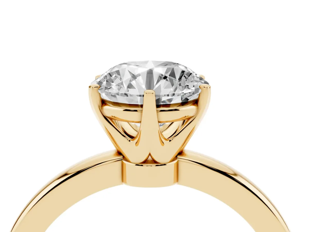 Round Cut Solitaire Diamond Ring with Six-Prong Setting on a Classic Band Yellow gold
