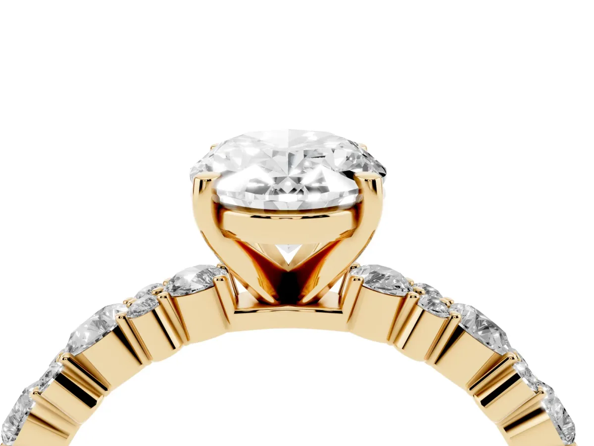 Oval Cut Diamond Side Stone Solitaire Ring with Round and Four-Prong Setting Yellow gold