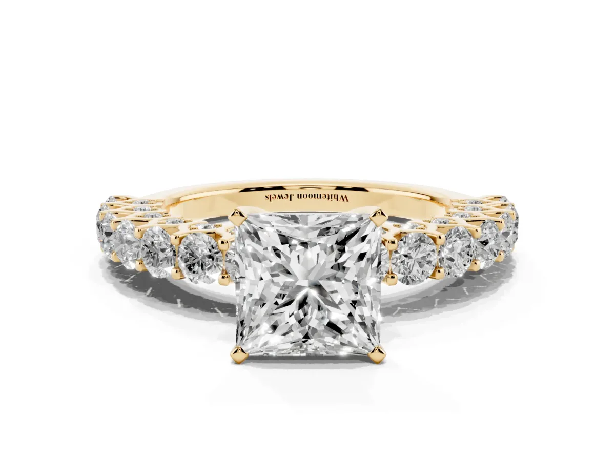 Princess Cut Diamond Solitaire Ring with Shared Prong Pavé Band and Four-Prong Setting Yellow gold