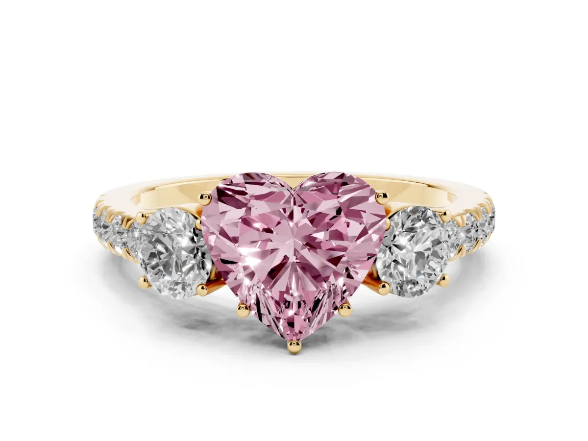 Fancy Pink Heart Cut Cut Diamond Three-Stone Ring with Round Side Stones and Pavé Band Yellow gold