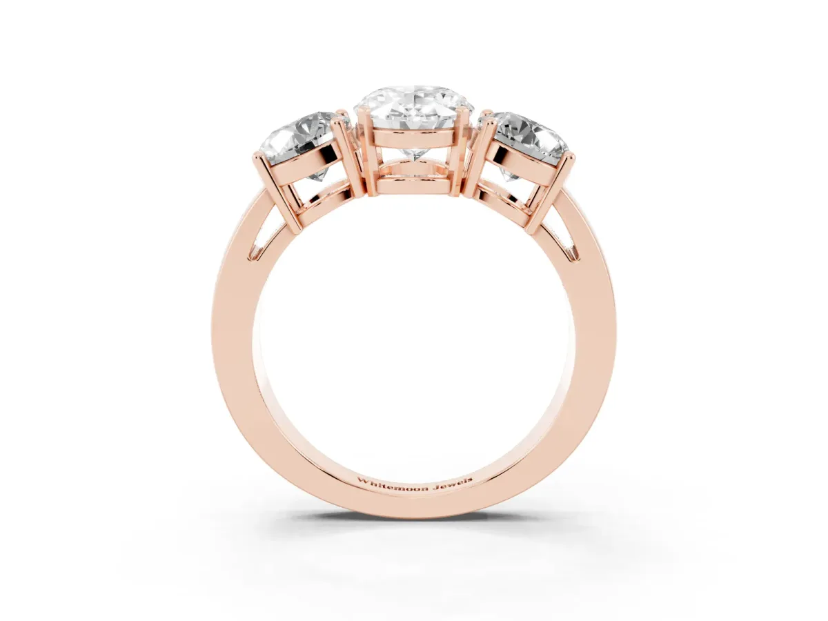 Three-Stone Oval Cut Diamond Ring with Round Side Stones, Classic Band, and Four-Prong Setting Rose gold