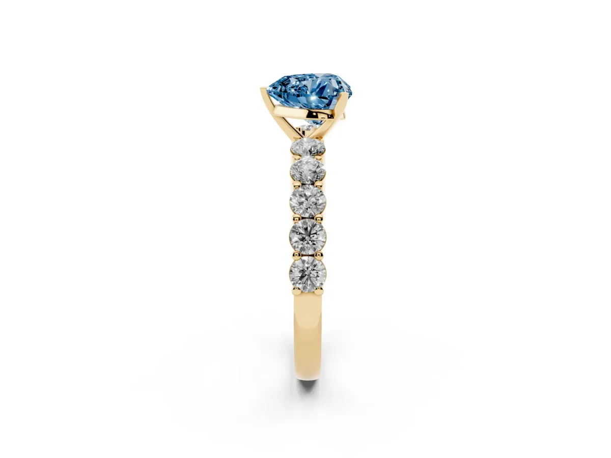 Fancy Blue Heart Cut Diamond Solitaire Ring with Shared Prong Round Side Stones Yellow gold
