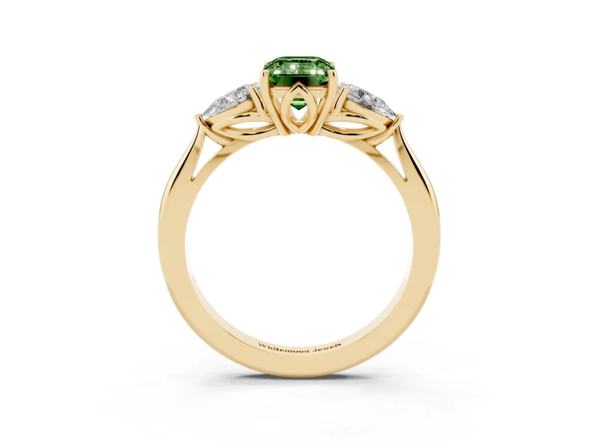 Fancy Green Three-Stone Emerald Cut Diamond Ring with Pear Side Stones in Four-Prong Setting Yellow gold