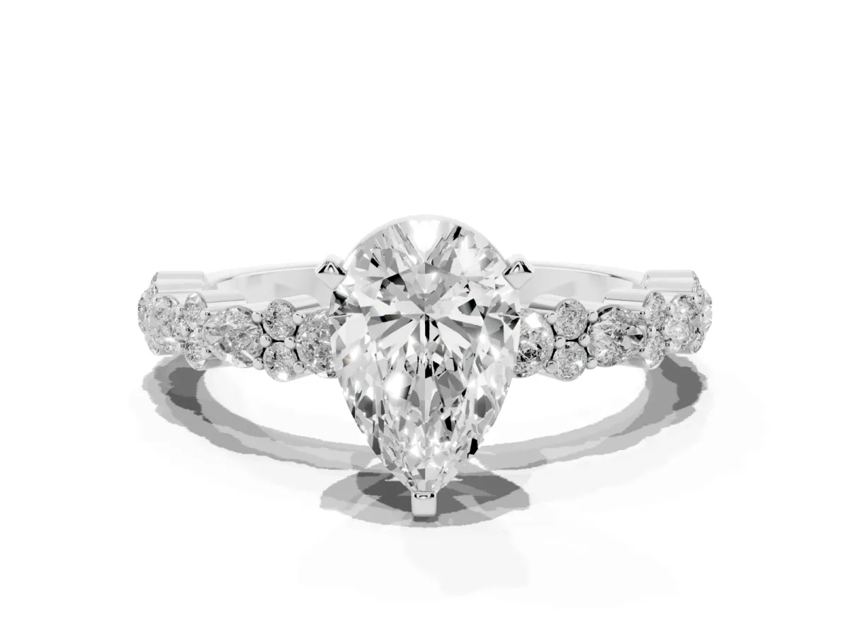 Pear Cut Diamond Side Stone Solitaire Ring with Round and Four-Prong Setting Silver