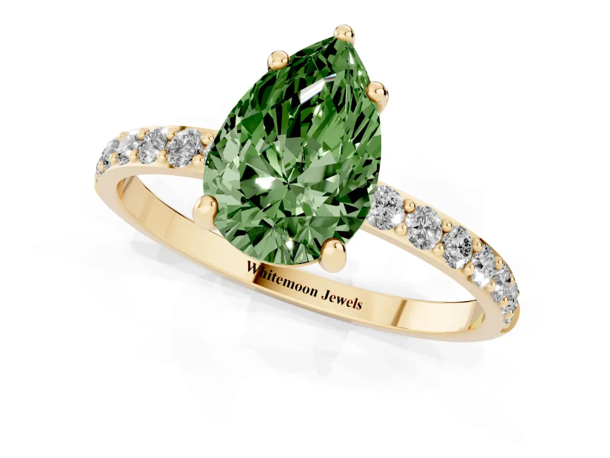 Fancy Green Pear Cut Diamond Solitaire Ring with Round Pavé Band and Prong Setting Yellow gold