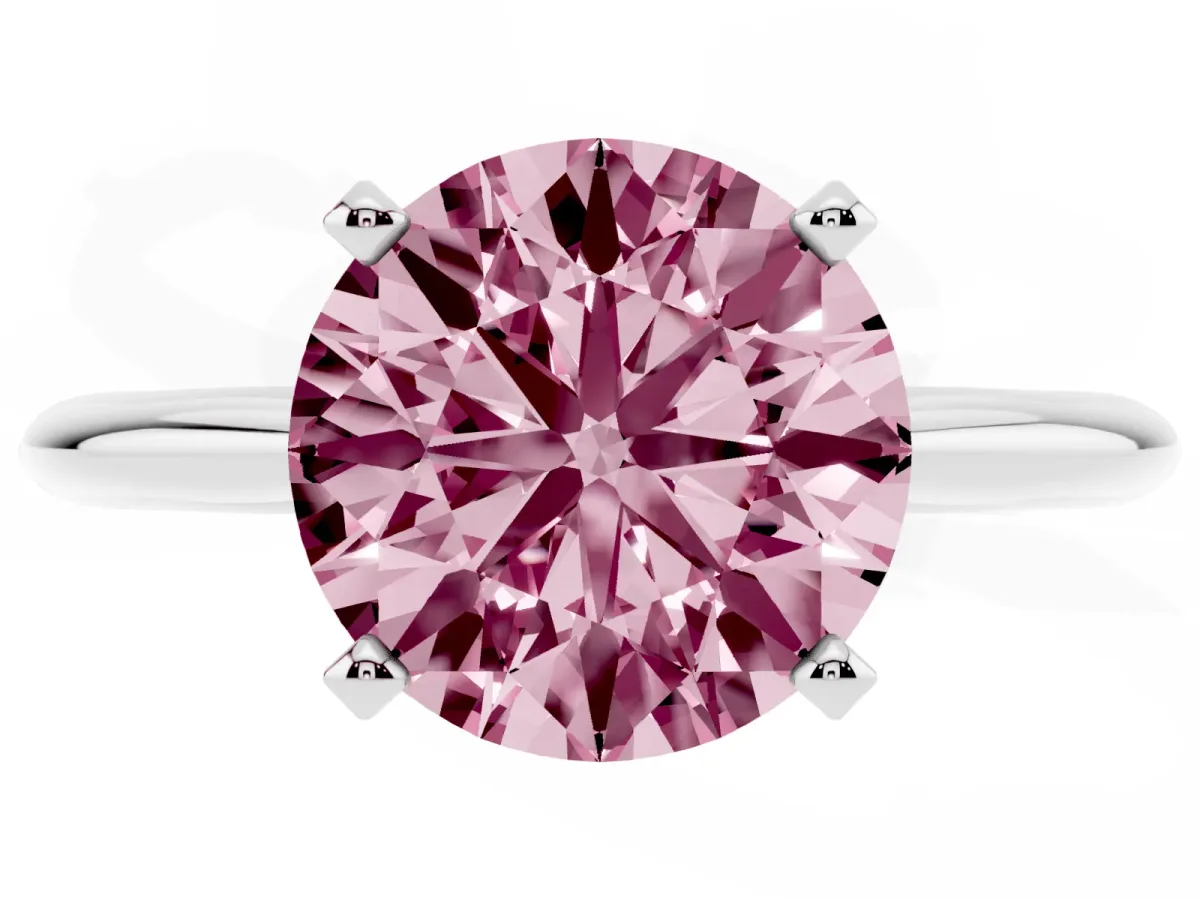 Fancy Pink Round Cut Cut Solitaire Ring with Four-Prong Setting on a Classic Band Silver