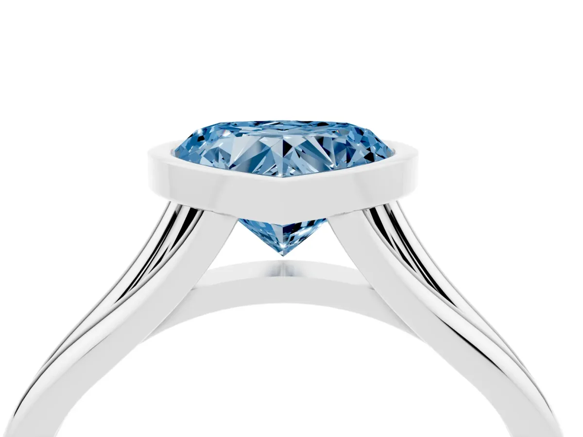 Fancy Blue Bezel Set Heart Cut Cut Solitaire Ring with Tapered Band White gold