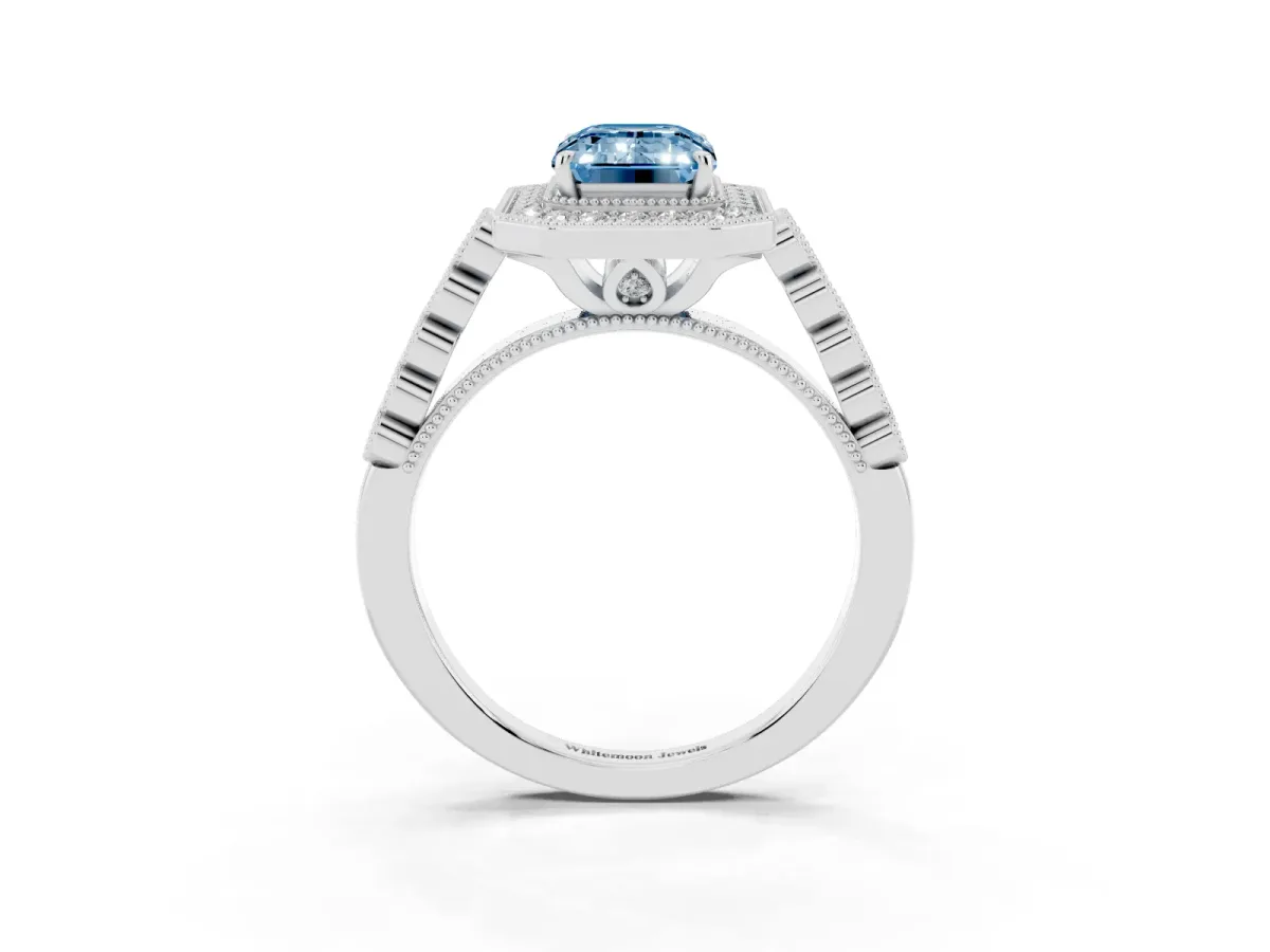 Fancy Blue Emerald Cut Halo Milgrain Solitaire with Bezel Set Side Stones and Pave Band White gold