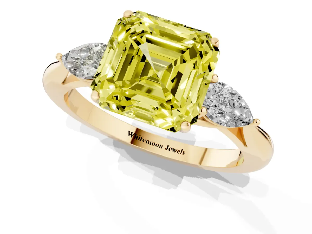 Fancy Yellow Three-Stone Asscher Cut Diamond Ring with Pear Side Stones in Four-Prong Setting Yellow gold