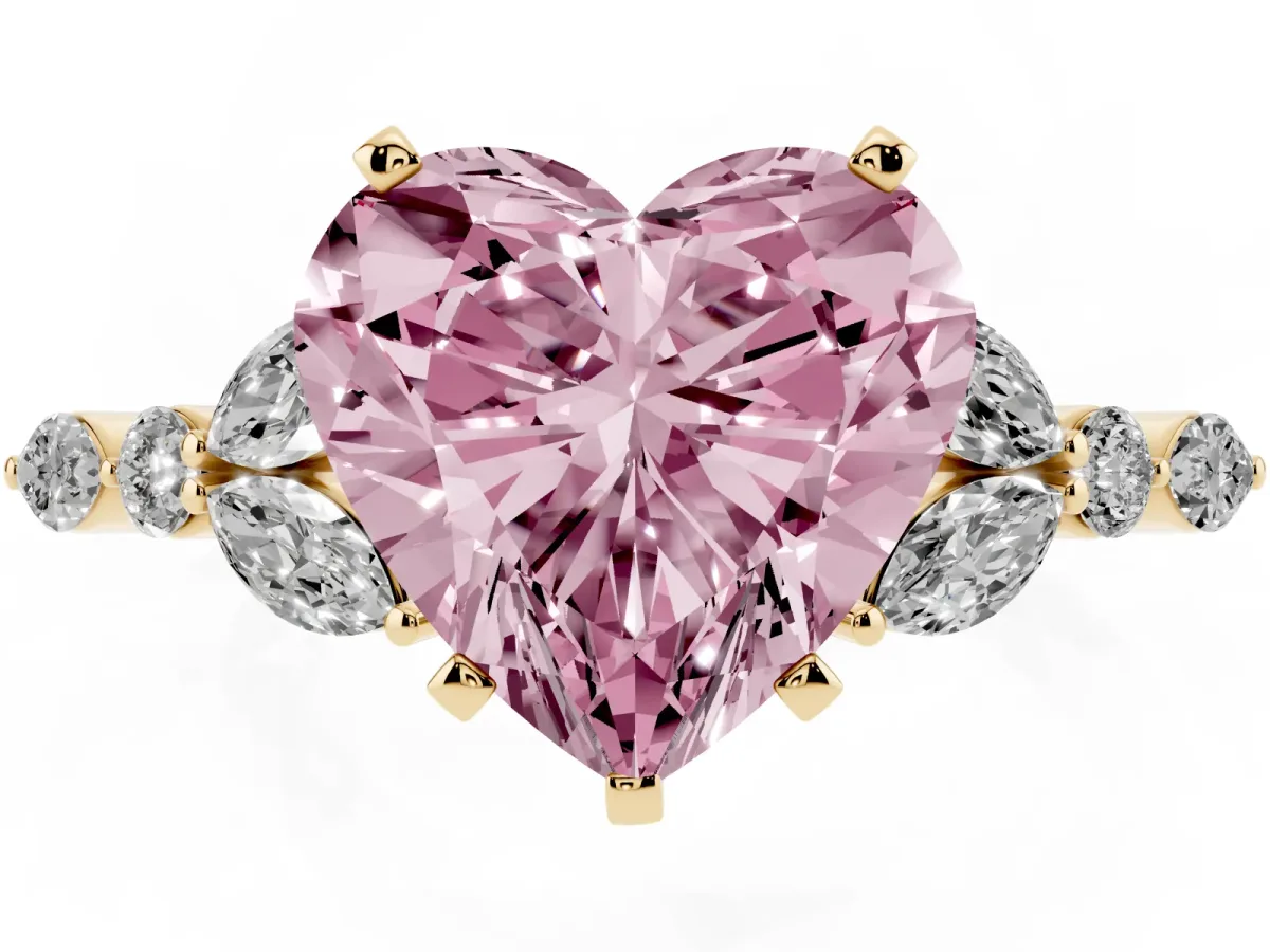 Fancy Pink Heart Cut Diamond Solitaire Ring with Side Stones and Four-Prong Setting Yellow gold