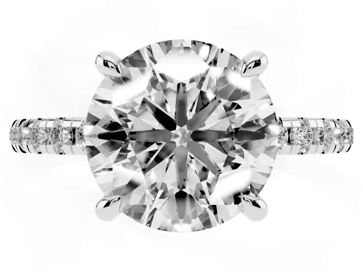 Round Cut Diamond Brilliant Solitaire Ring with Pavé Band and Four-Prong Setting Silver