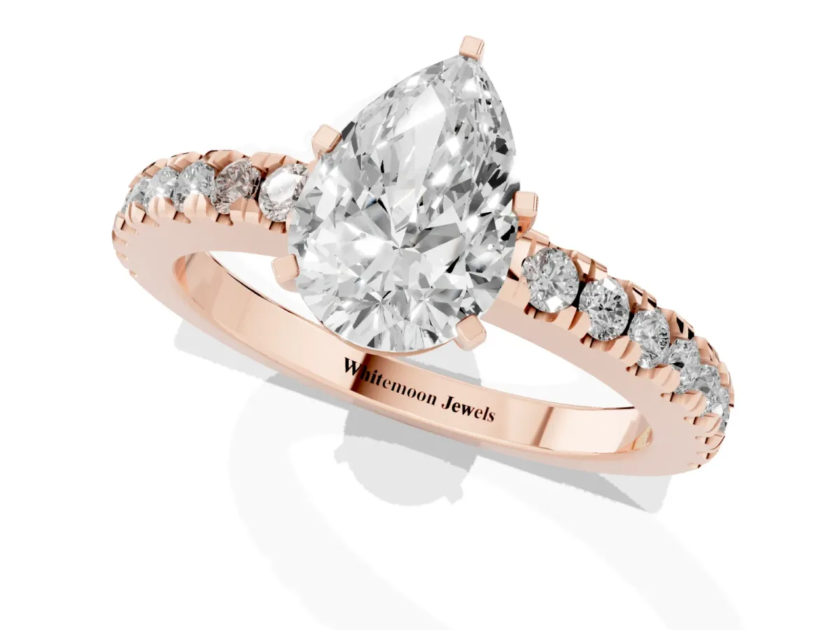 Pear Cut Solitaire Diamond with Pavé Band and Four-Prong Setting Rose gold