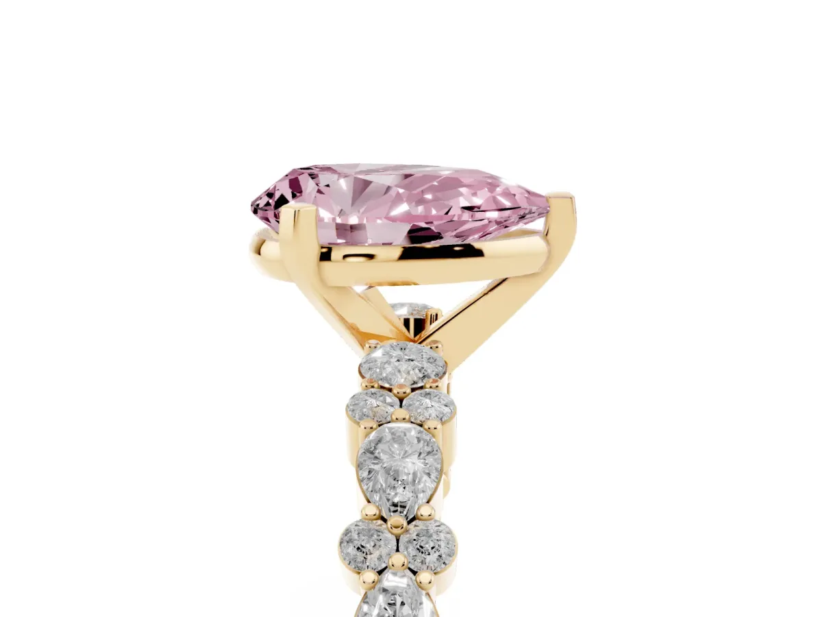 Fancy Pink Pear Cut Diamond Side Stone Solitaire Ring with Round and Four-Prong Setting Yellow gold