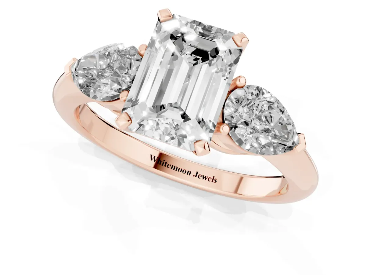 Three-Stone Emerald Cut Diamond Ring with Pear Side Stones and Four-Prong Setting Rose gold