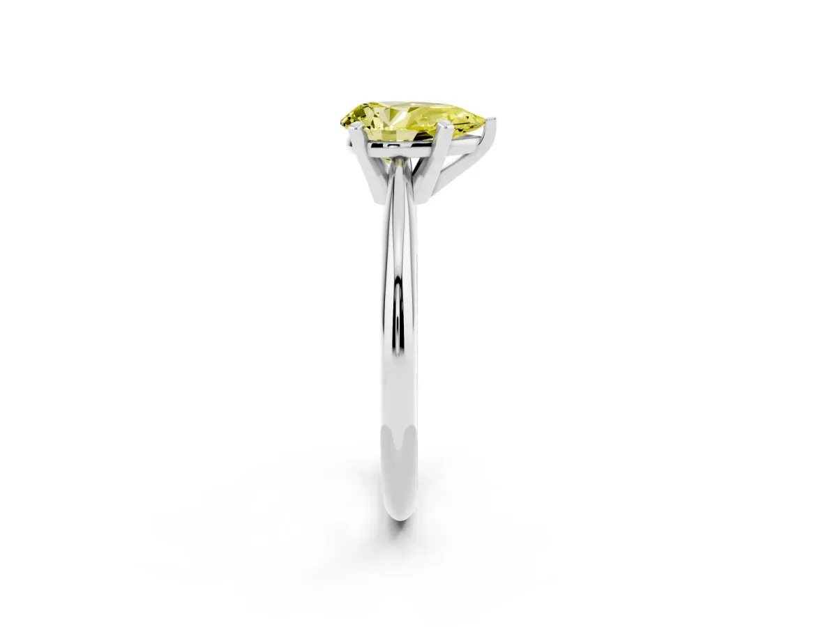 Fancy Yellow Pear Cut Cut Solitaire Ring with Four-Prong Setting on a Classic Band Silver