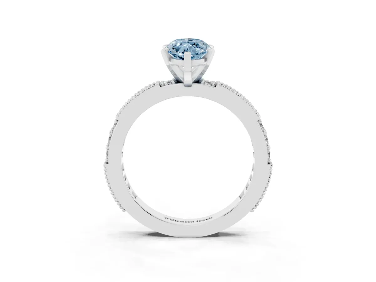 Fancy Blue Marquise Cut Solitaire with Pavé Band and Four-Prong Setting Silver