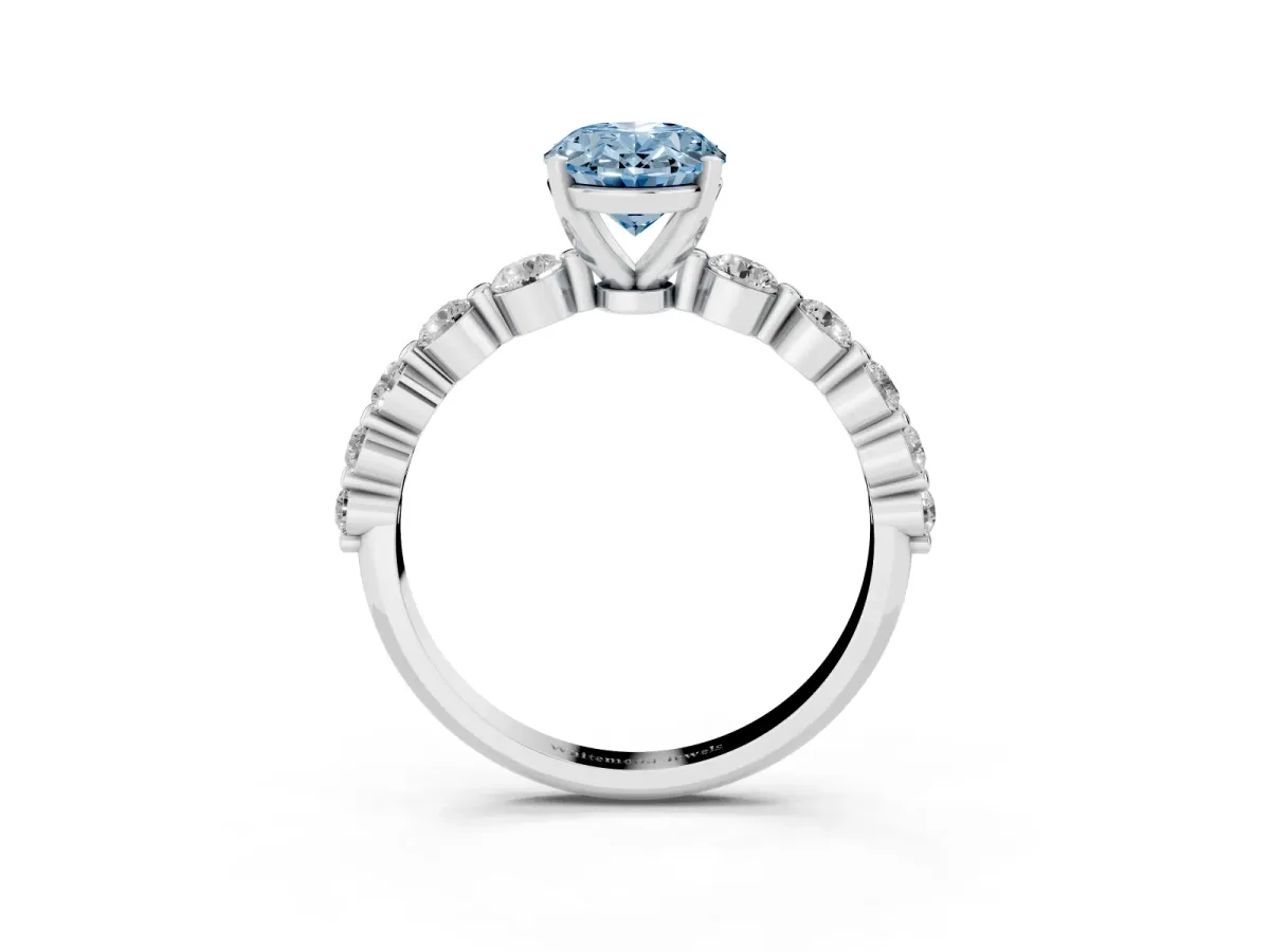 Fancy Blue Oval Cut Solitaire Diamond Ring with Pave Band and Four-Prong Setting Silver