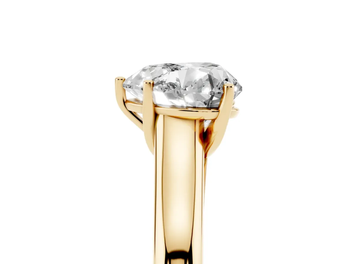 Heart Cut Cut Diamond Solitaire Engagement Ring with Tapered Plain Band and Four-Prong Setting Yellow gold