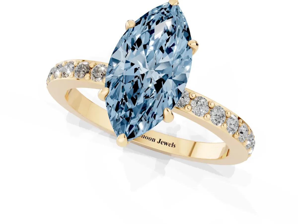 Fancy Blue Marquise Cut Diamond Pavé Engagement Ring with Round Accents and Prong Setting Yellow gold