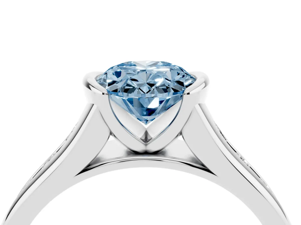 Fancy Blue Oval Cut Solitaire Bezel-Set Diamond Ring with Channel-Set Band Platinum