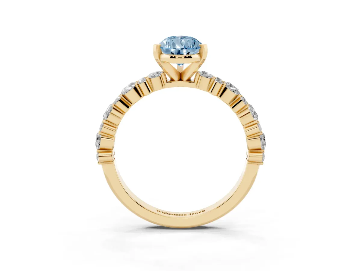 Fancy Blue Pear Cut Diamond Side Stone Solitaire Ring with Round and Four-Prong Setting Yellow gold