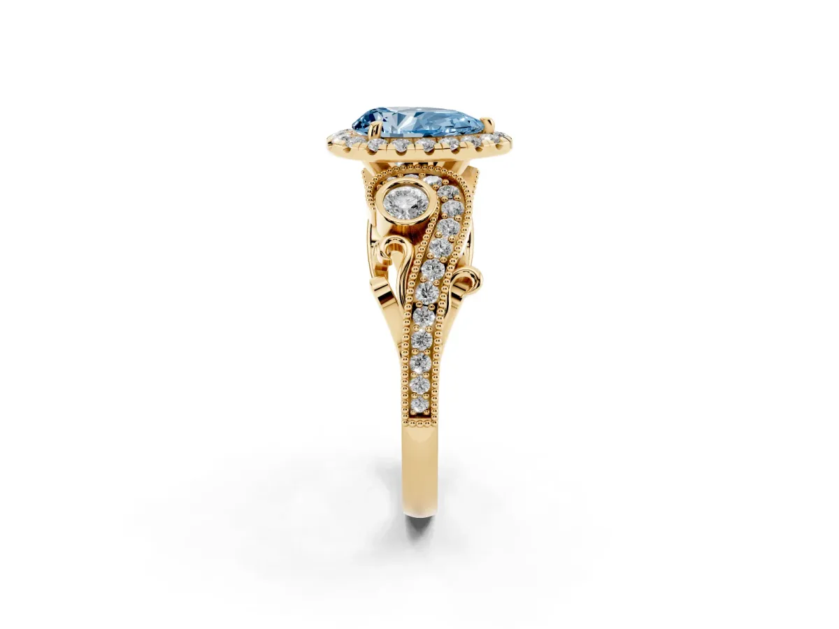 Fancy Blue Pear Cut Halo Diamond Ring with Milgrain and Bezel Accents on a Split Shank Band Yellow gold