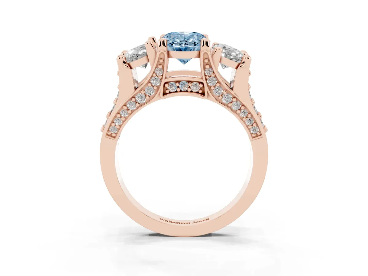 Fancy Blue Oval Cut Diamond Three-Stone Ring with Channel Set Band and Four-Prong Setting Rose gold