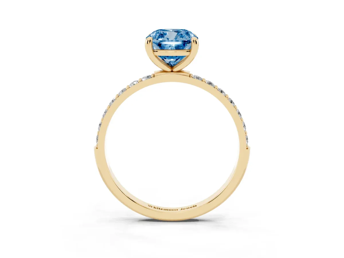 Fancy Blue Cushion Cut Diamond Solitaire Ring with Round Pavé Band and Prong Setting Yellow gold