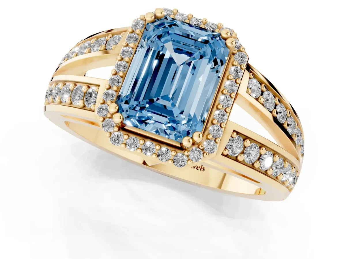 Fancy Blue Emerald Cut Diamond Halo Ring with Split Shank Pavé Band and Four-Prong Setting Yellow gold