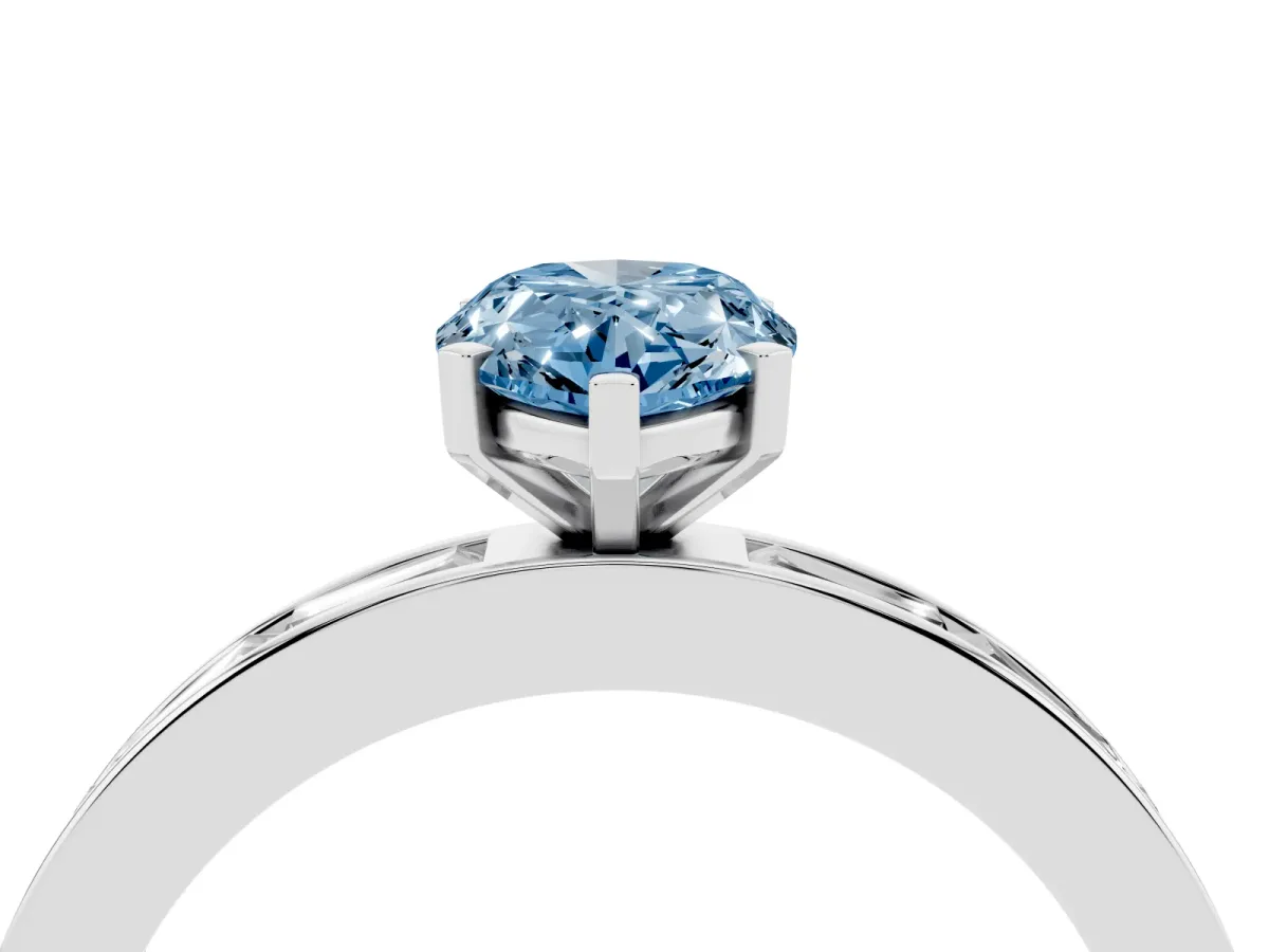 Fancy Blue Pear Cut Solitaire Diamond Ring with Channel-Set Baguette Band and Four-Prong Setting White gold