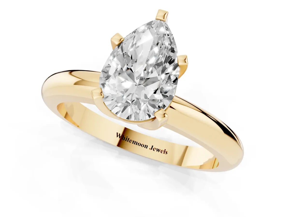 Pear Cut Diamond Solitaire Engagement Ring with Round Band and Four-Prong Setting Yellow gold