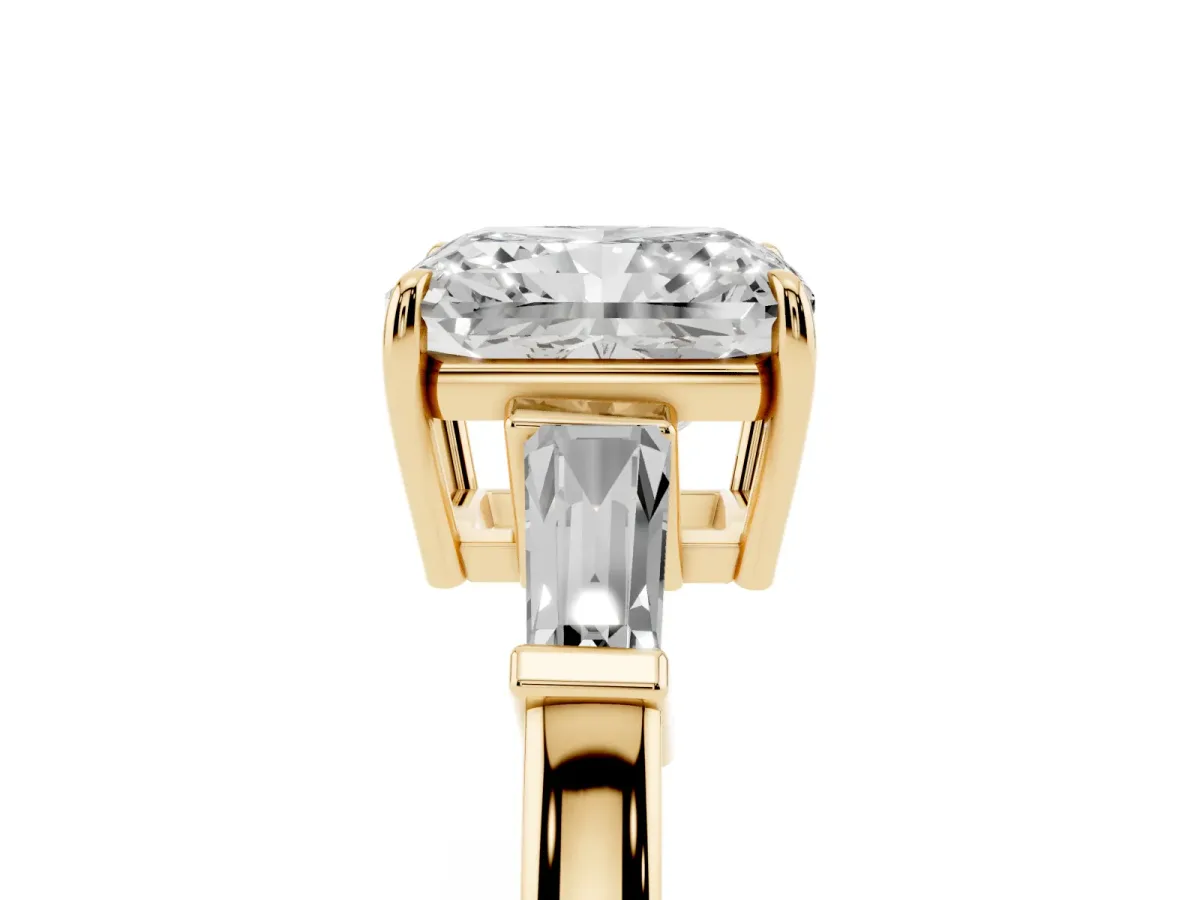 Radiant Cut Diamond Three-Stone Ring with Tapered Baguette Side Stones and Prong Setting Yellow gold