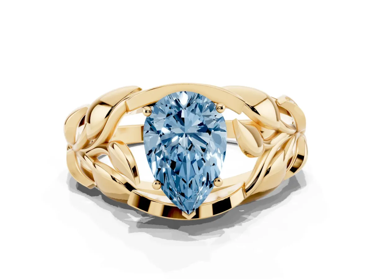Fancy Blue Pear Cut Diamond Leaf-Inspired Engagement Ring with Round Accents and Prong Setting Yellow gold