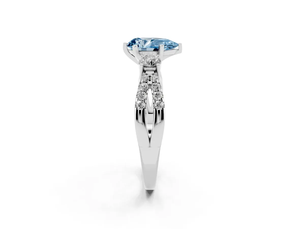 Fancy Blue Pear Cut Diamond Three-Stone Ring with Pavé Split Shank and Four-Prong Setting Silver