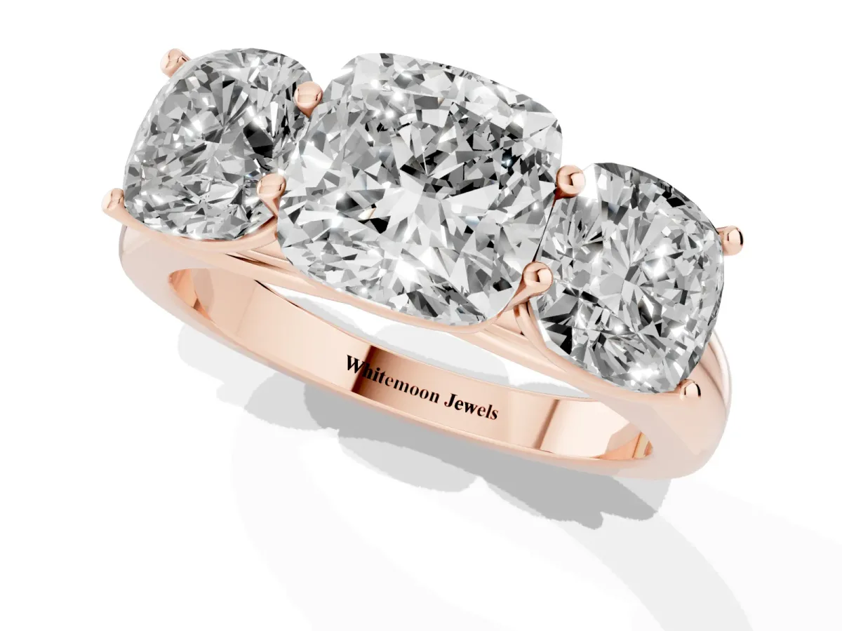 Cushion Cut Three-Stone Diamond Ring with Prong Setting on a Classic Band Rose gold