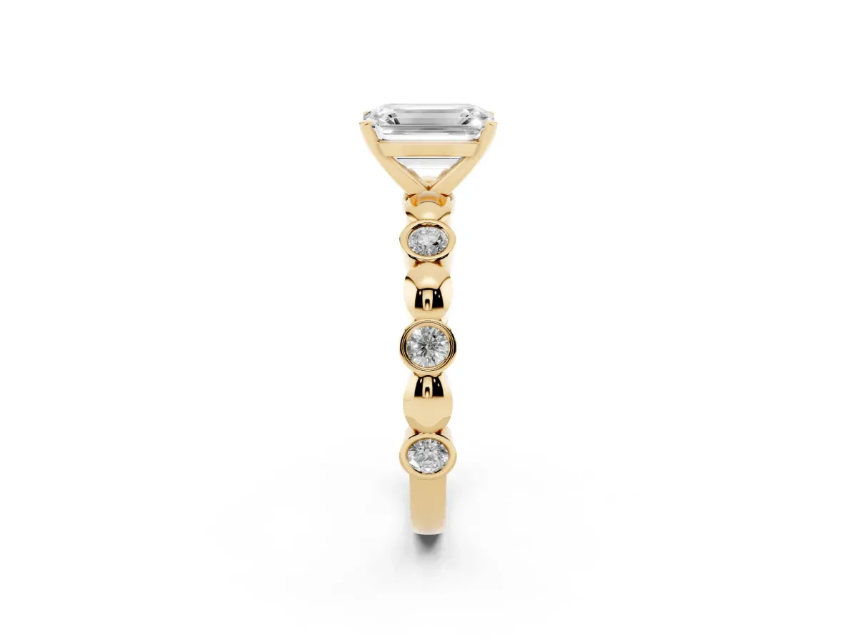 Emerald Cut Solitaire Bezel-Set Diamond Ring with Beaded Band and Four-Prong Setting Yellow gold