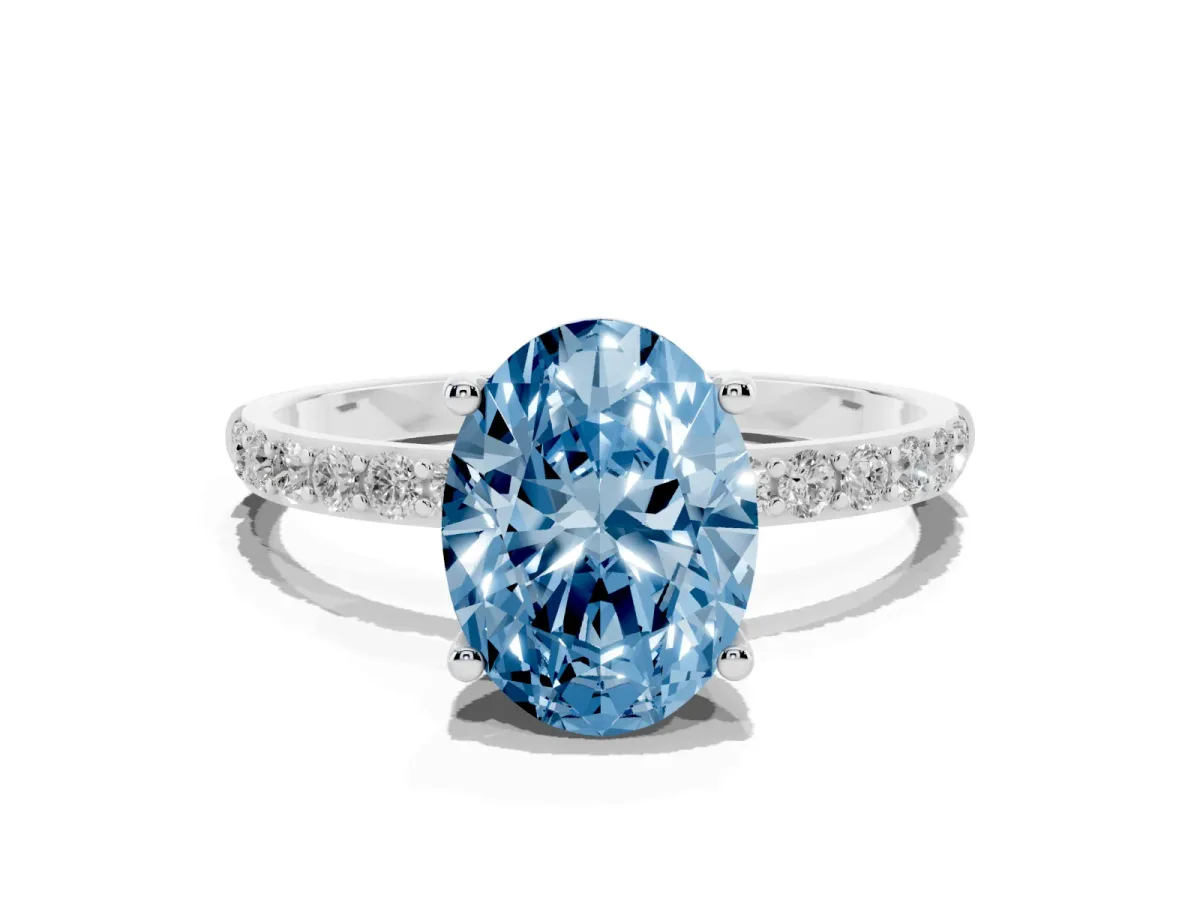 Fancy Blue Oval Cut Diamond Solitaire Ring with Round Pavé Shoulders and Prong Setting Silver