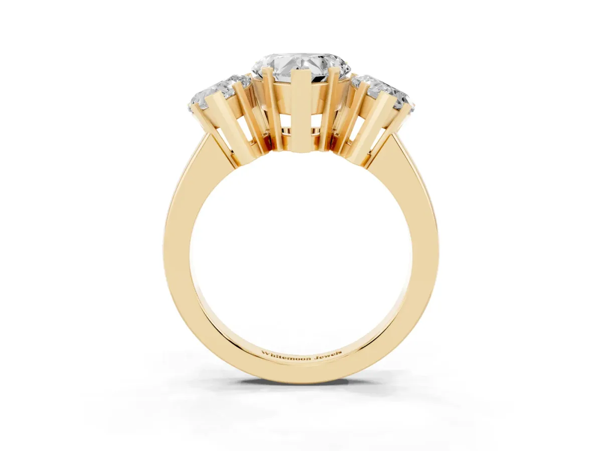 Three-Stone Heart Cut Cut Diamond Ring with Channel Set Band and Four-Prong Setting Yellow gold