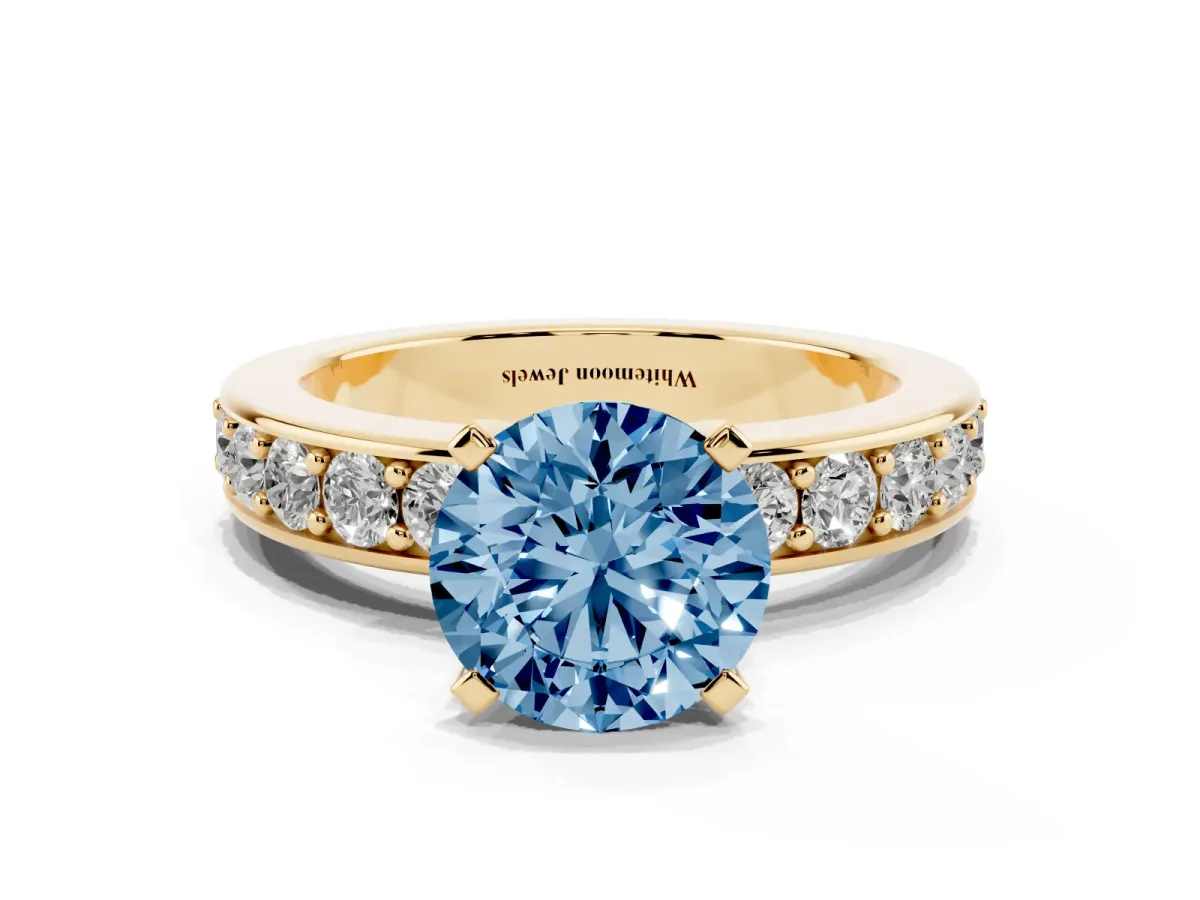 Fancy Blue Round Cut Diamond Engagement Ring with Channel Set Round Band and Prong Setting Yellow gold