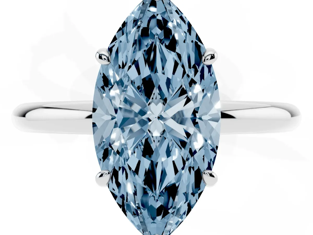 Fancy Blue Marquise Cut Solitaire Diamond Ring with Four-Prong Setting on a Plain Band Silver