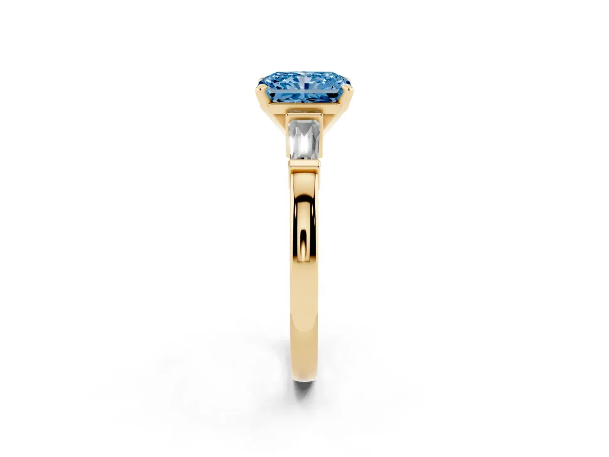 Fancy Blue Radiant Cut Cut Diamond Solitaire Ring with Tapered Baguette Accents and Four-Prong Setting Yellow gold