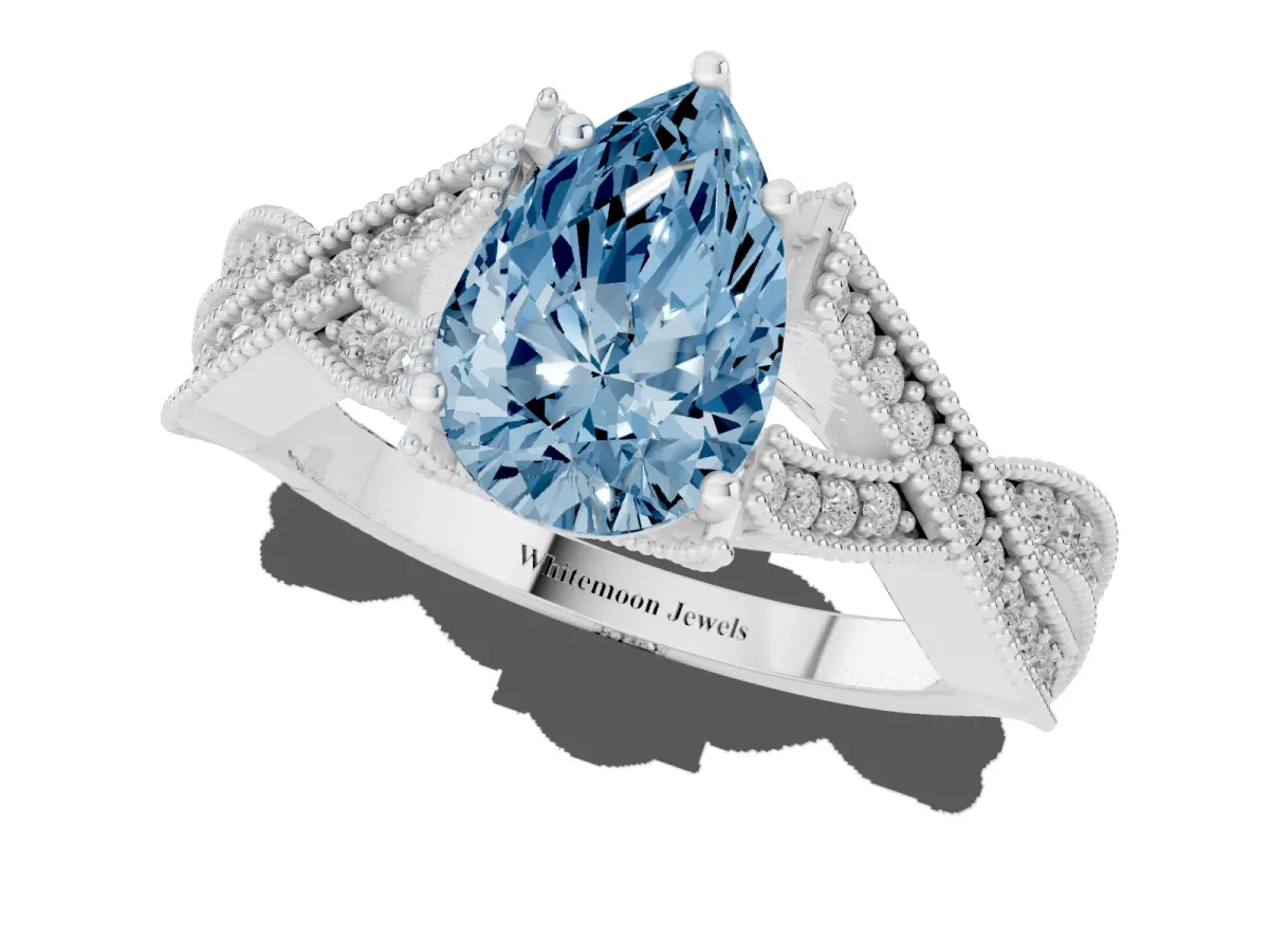 Fancy Blue Pear Cut Cut Diamond Twisted Band with Milgrain Pave Setting and Four-Prong Setting Silver